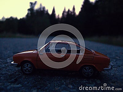 Neue Welt, Germany - September 21, 2019: orange czechoslowak car Skoda 110R from year 1980 on road at evening Editorial Stock Photo