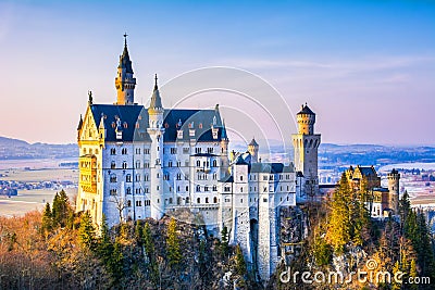 Neuschwanstein, beautiful fairytale castle near Munich in Bavaria, Germany, with colorful trees. Stock Photo