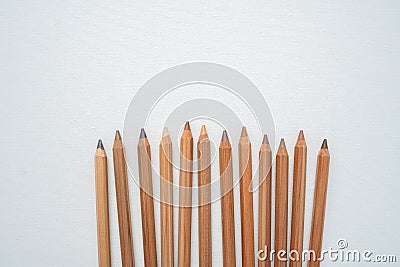Neutral color skin pencils disperse on a white canvas Stock Photo