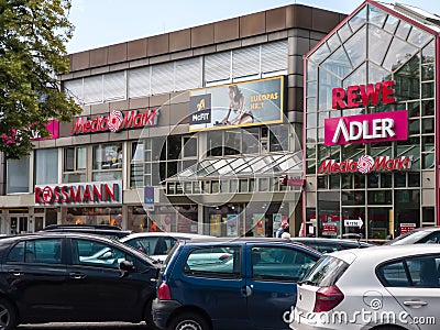 Neuwied, Germany - June 14, 2019: front of the shopping center with brands of ADLER, McFIT, Media Markt, REWE and ROSSMANN Editorial Stock Photo