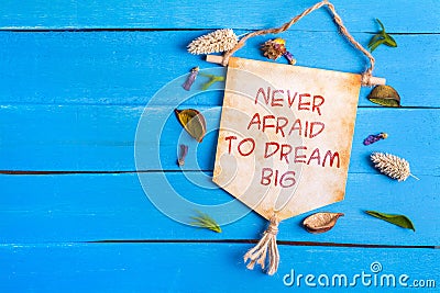 Never afraid to dream big text on Paper Scroll Stock Photo