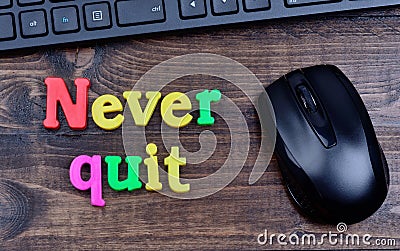 Never quit words on table Stock Photo