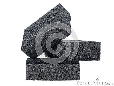 New absorbent black sponge isolated on white background. Black kitchen sponges Stock Photo