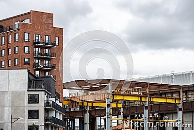 New apartment complexes beside old wharf structures.. Editorial Stock Photo