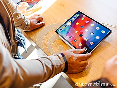 New Apple Computers iPad Pro tablet senior admiring tablet Editorial Stock Photo