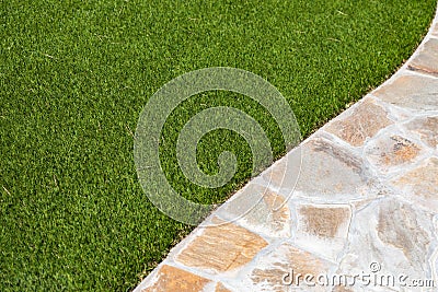New Artificial Grass Installed Near Walkway. Stock Photo