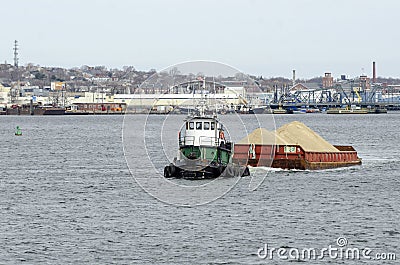 Tug Bucky towing sand barge Editorial Stock Photo