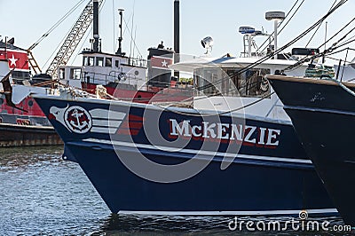 Cluster of docked tugs and fishing vessels Editorial Stock Photo