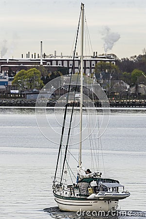 Sailboat leaving New Bedford on windless morning Editorial Stock Photo