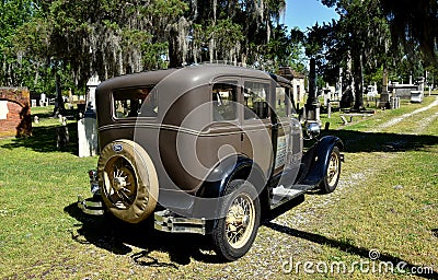 New Bern, NC: Cedar Grove Cemetery & Model A Ford Editorial Stock Photo