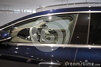 new blue electric Mercedes EQS 580 4MATIC car in showroom, EV contemporary, technological advancements in automotive industry, Editorial Stock Photo