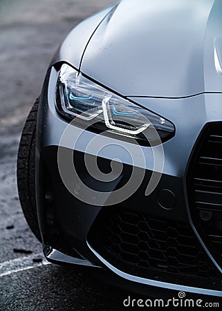 New BMW M3 G80 wrapped in black matte vinyl wrap and equipped with laser led head lights and custom wide body Editorial Stock Photo