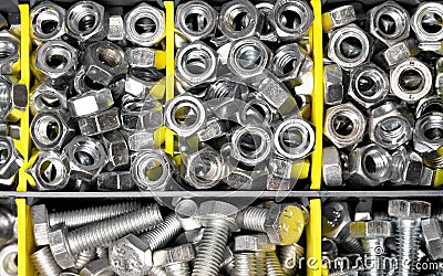 New bolts and nuts sorted in container shot flatlay, background, repair concept Stock Photo