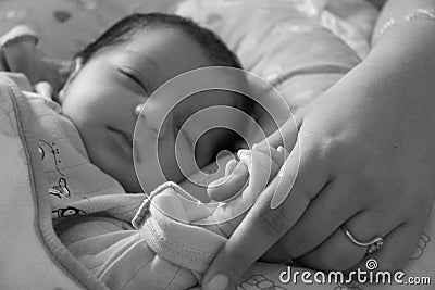 New bond of Baby and mother; bonding and holding for first time Stock Photo