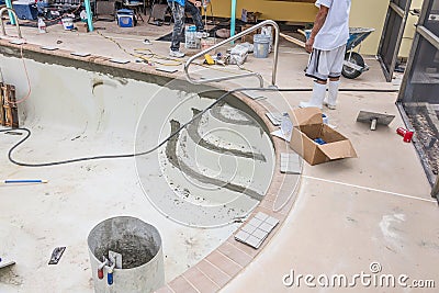 New brick coping and grout pool remodel Stock Photo