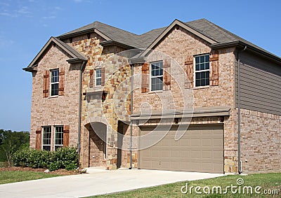 A new two floors brick house in suburban Stock Photo