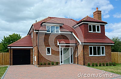 New build, empty, detached family house with garage. Stock Photo