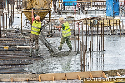 New building under construction and construction site of a residential building. On the site, preparatory work for concreting is b Editorial Stock Photo