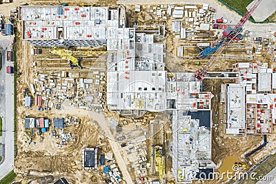 New building under construction with working cranes. aerial top down view Stock Photo