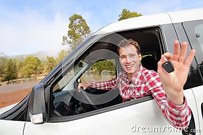 New cars - man driving car showing car keys happy