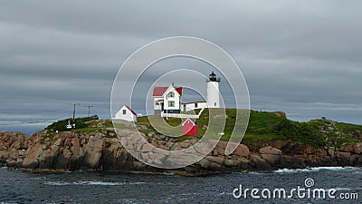 New Castle, New Hampshire - July 5 2021: Portsmouth Harbor Lighthouse located on a rocky coast of Atlantic Ocean, guiding boats Editorial Stock Photo