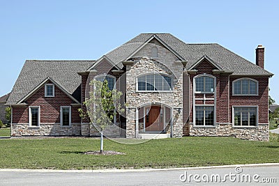 New construction brick and stone home Stock Photo