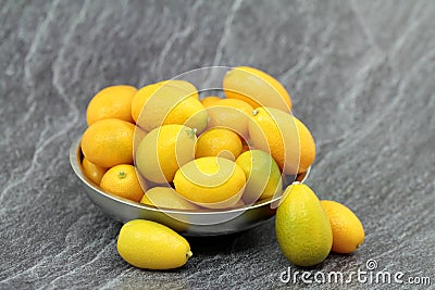 New crop, fresh kumquats in the metal bowl Stock Photo