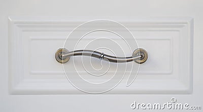 New curved metal handle on entrance door Stock Photo