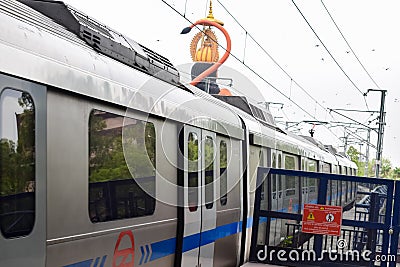 New Delhi India â€“ June 21 2022 - Delhi Metro train arriving at Jhandewalan metro station in New Delhi Stock Photo