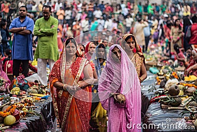 New Delhi, Delhi/ India- October 24 2020 : Women of India celebrating Chhath Pooja by drowning themselves in Water for praying to Editorial Stock Photo
