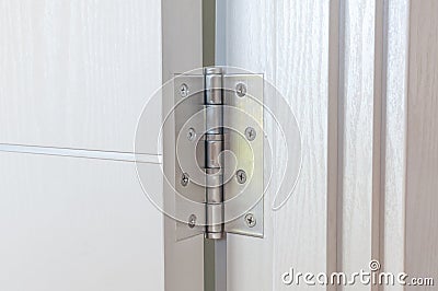 New door hinges Aluminum on white door Stock Photo