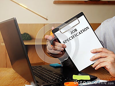 New employee holds job specification. Stock Photo
