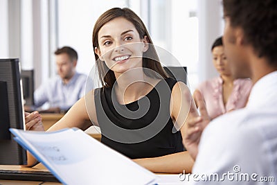 New Employee Starting Work In Busy Office Stock Photo