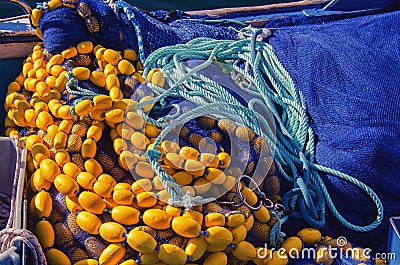 New fishing equipment. Yellow floats and blue fishing net Stock Photo