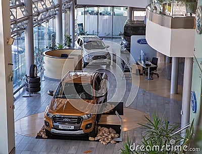 New Ford cars on display of dealership room. Kyiv, Ukraine Editorial Stock Photo