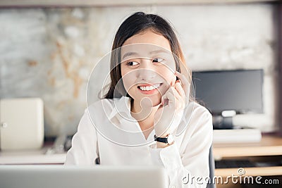 New generation asians business woman using laptop at office,Asian women sitting smiling while working on mobile office concept Stock Photo