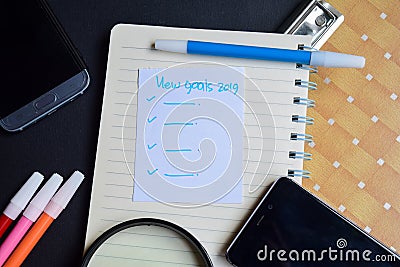 New goals 2019 word written on paper. new goals 2019 text on workbook, technology business concept Stock Photo