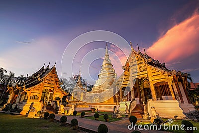 New golden pagoda, Phra Singh temple twilight time Viharn Lai Kam Wat Phra Singh Stock Photo