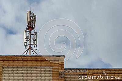 New GSM antennas on the roof of a residential building in the city for transmitting a 5g signal are a danger to human health. Stock Photo