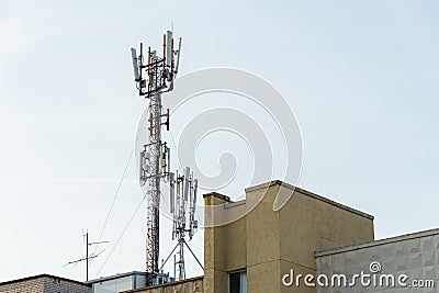 New GSM antennas on the roof of a residential building in the city for transmitting a 5g signal are a danger to human health. Stock Photo