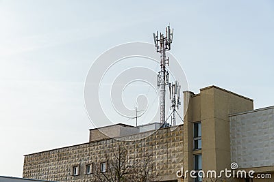 New GSM antennas on the roof of a residential building in the city for transmitting a 5g signal are a danger to human health. Stock Photo