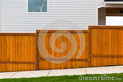 New Red Stained Garden Wood Fence Construction Stock Photo