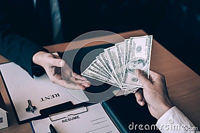 New homeowner handed the money and real estate trading concept Stock Photo