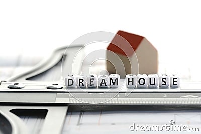 New house project with dream house text on ruler. Architecture plan and small model house Stock Photo