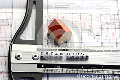 New house project with dream house text on ruler. Architecture plan and small model house Stock Photo