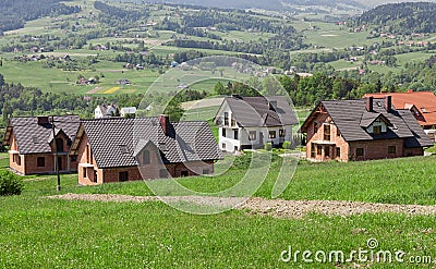 A new housing estate under construction. A housing estate for new homes in the periphery. mountainous terrain, Building home Stock Photo