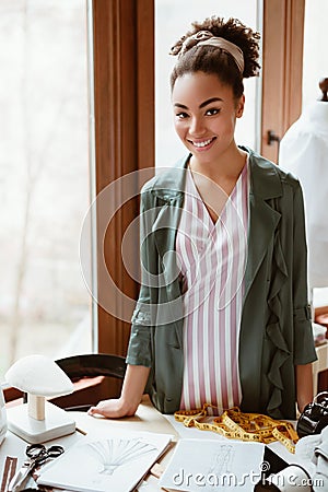 New idea is awersome. Stylish woman tailor trying to develop new clothes Stock Photo