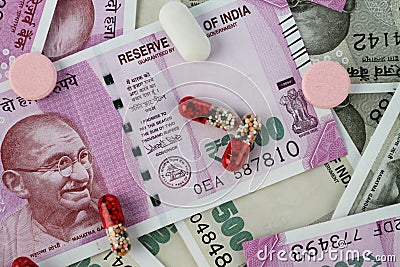 New Indian Rupee Bank Notes with Medicines / Pills Stock Photo