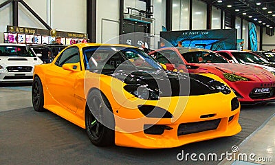 New Japanese tuned yellow sports car at the Royal Auto Show. Editorial Stock Photo