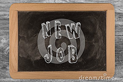 New job - chalkboard with 3D outlined text - on wood Stock Photo